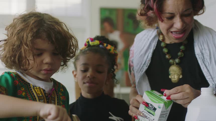 Children cook with their mother