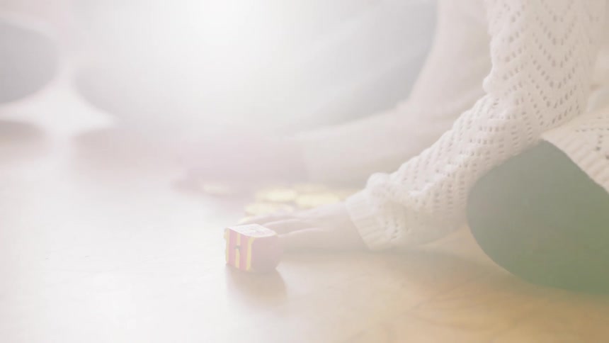 Girl plays game on floor with chocolate coins