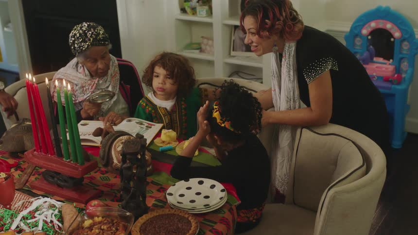 A family are at the table talking