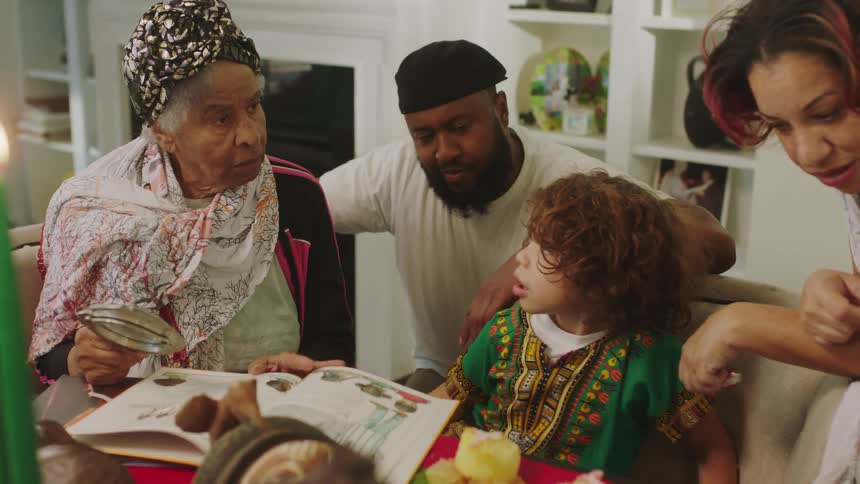 A family read a book together at home