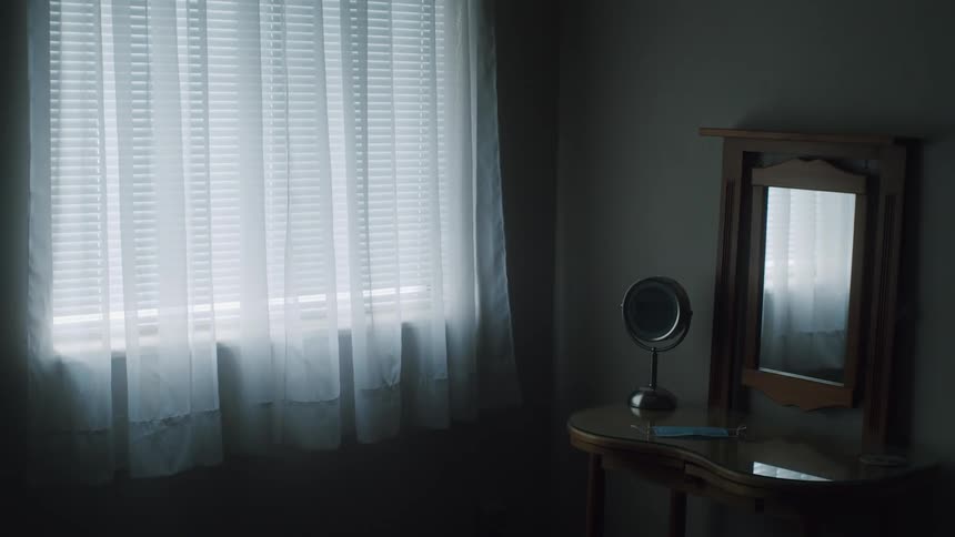 Interior view of room with mirrors curtains and blinds