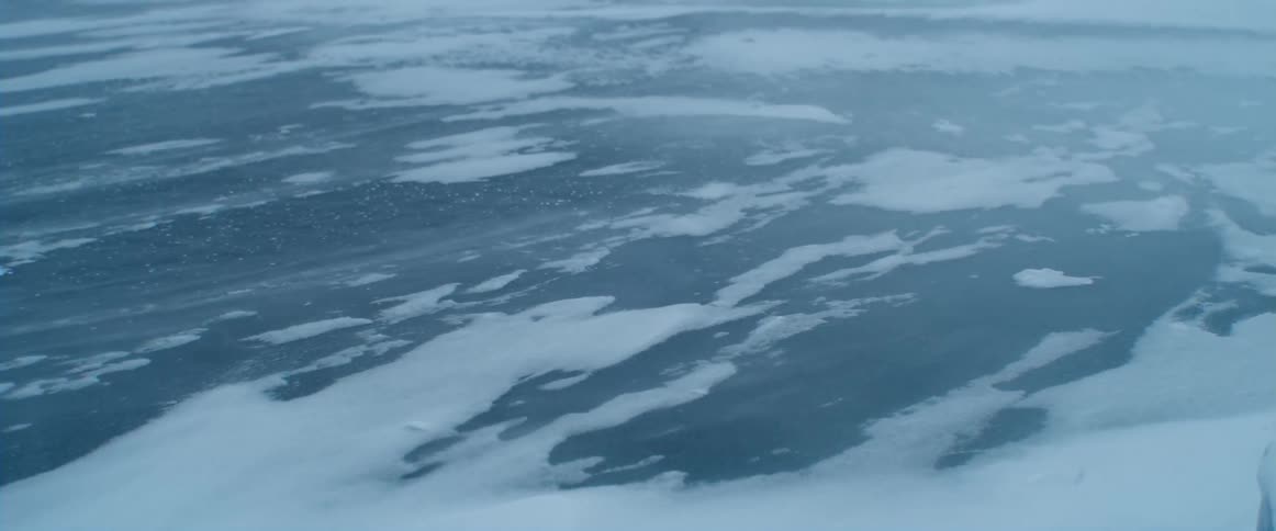 Snow is blowing across the ice