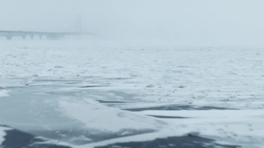 Aerial view of snow in an arctic location is displayed