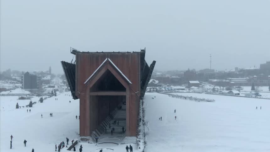 People walk around the tunnel in the snow