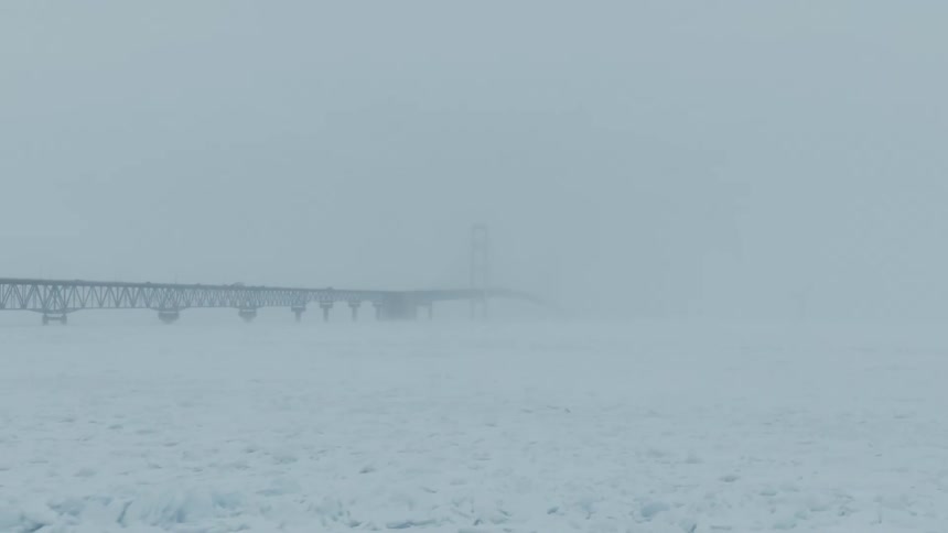 Ice and snow cover the surface of the sea