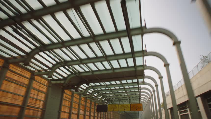 The train is moving past the station