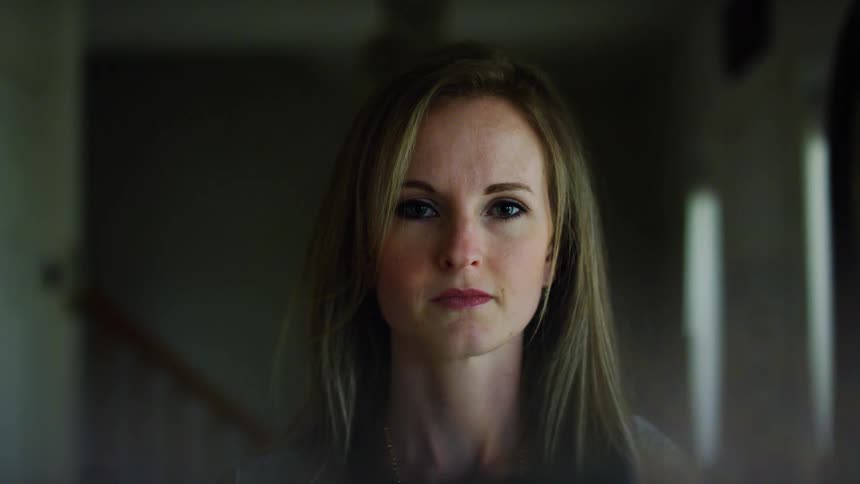 A portrait of a woman in a room