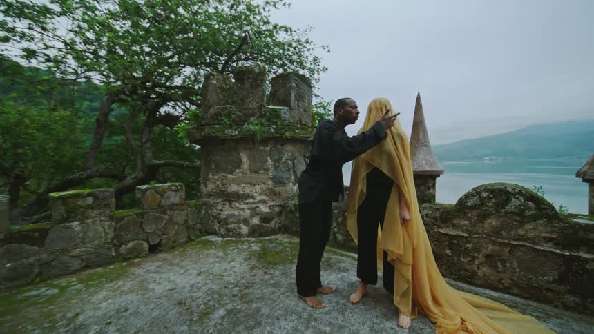A man is yelling at a female outdoors in spring