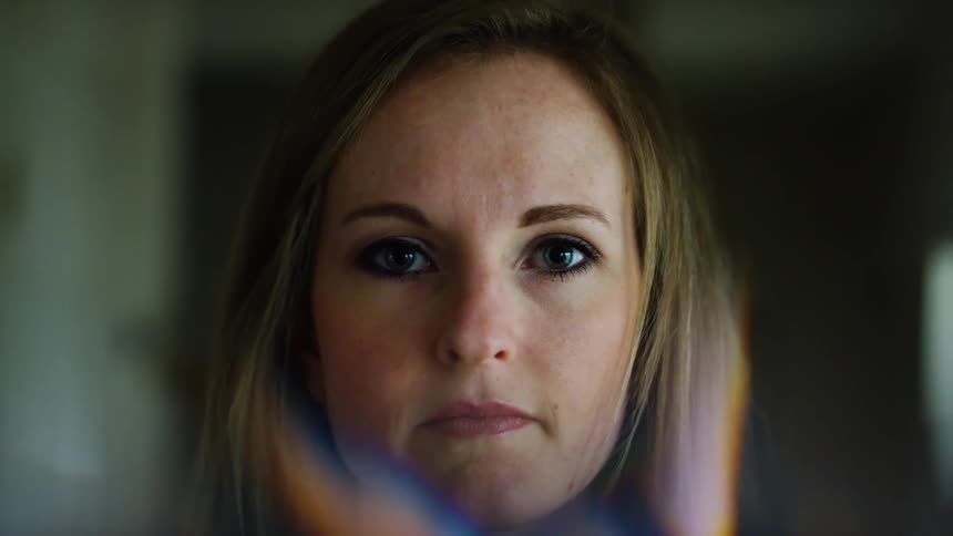 A portrait of a woman in a room