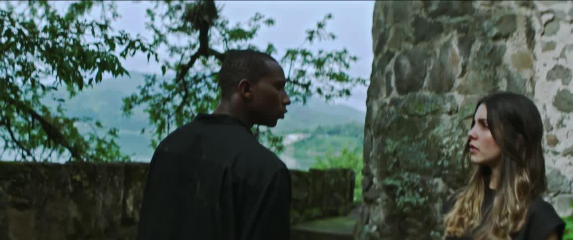 A man and woman dancing outdoors