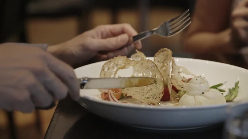 People are beginning to eat from dishes