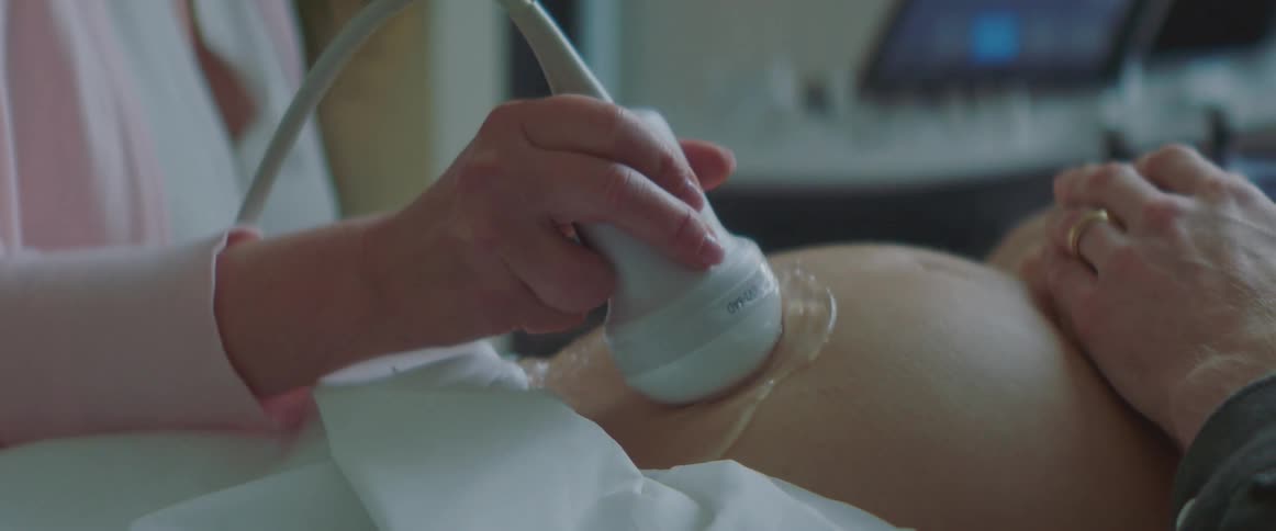 Close up of an ultrasound performed on a womans pregnant belly