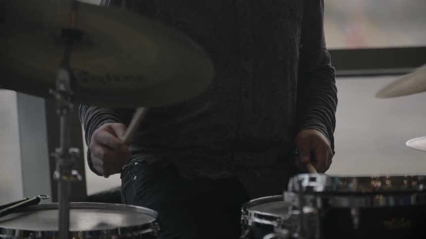 A man is playing the drums
