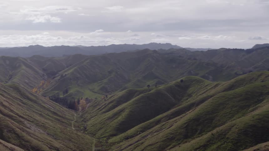A large range of grass covered hills in all directions