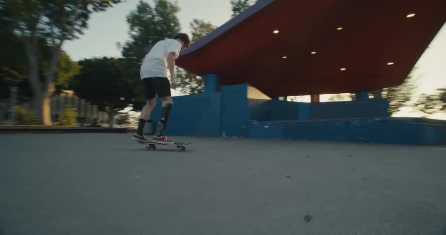 A man falls after doing a jump on the skateboard