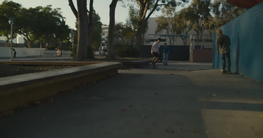 A group of people skateboarding outdoors