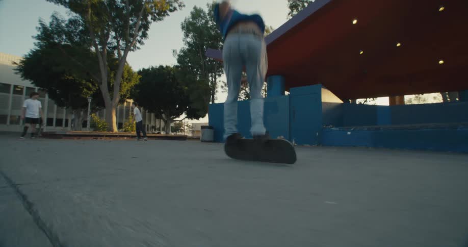 Man falls as he tries to perform trick on skateboard at park