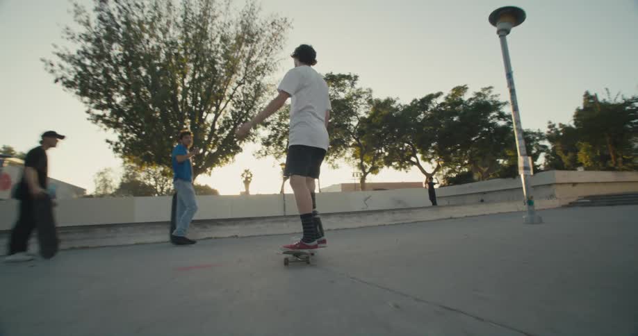 A man with a prosthetic leg performs a trick on a skateboard