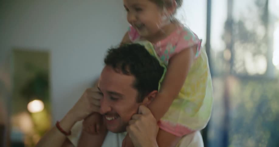A father mother and daughter together in a house