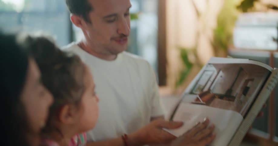 Father shows picture of room to family comparing it to contents drawn on screen