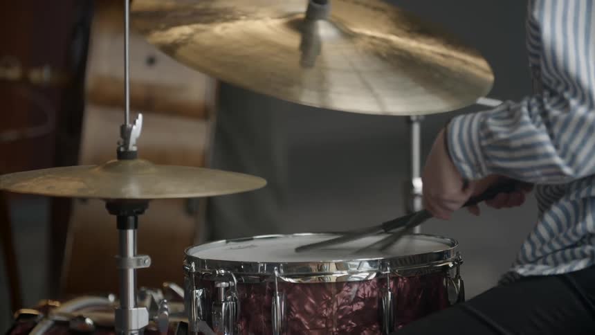 A person is playing drums