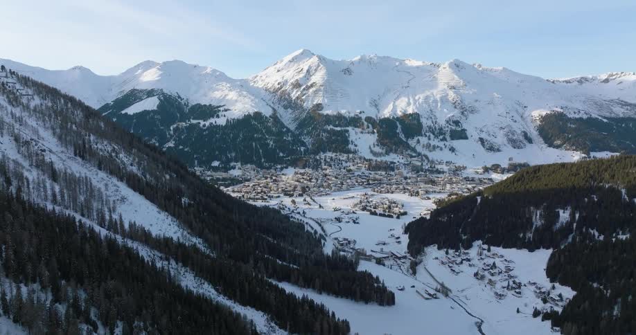 An aerial view of a snow covered mountain range