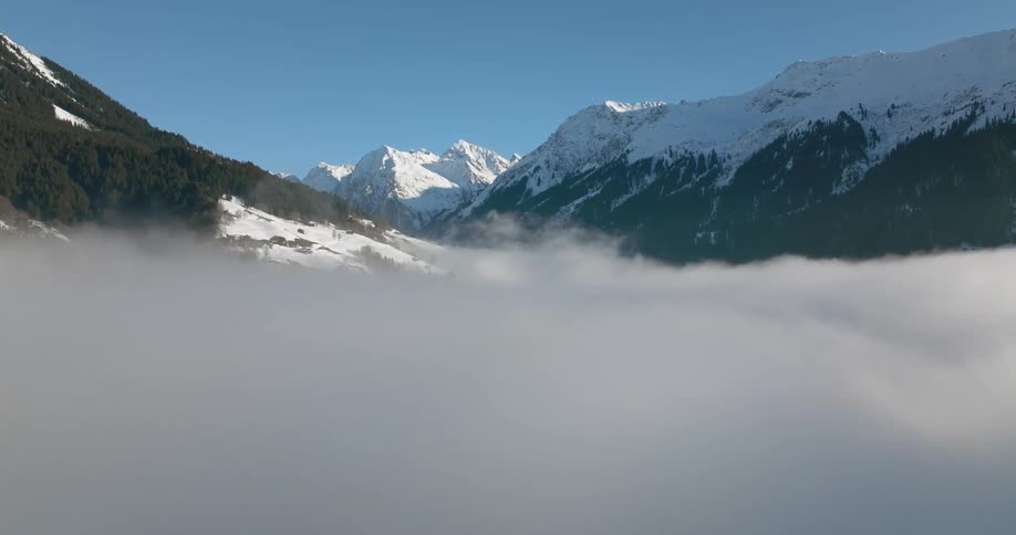 An aerial view of snow capped mountains