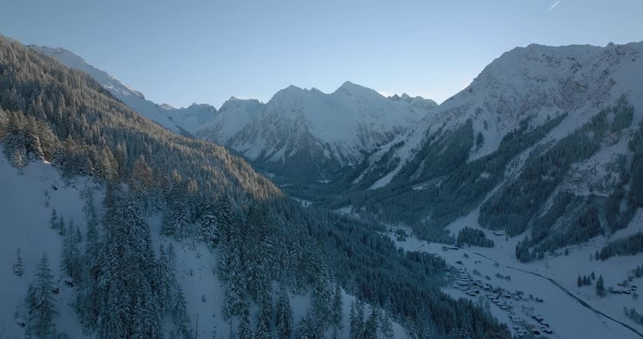 An aerial view of a snow covered mountain range