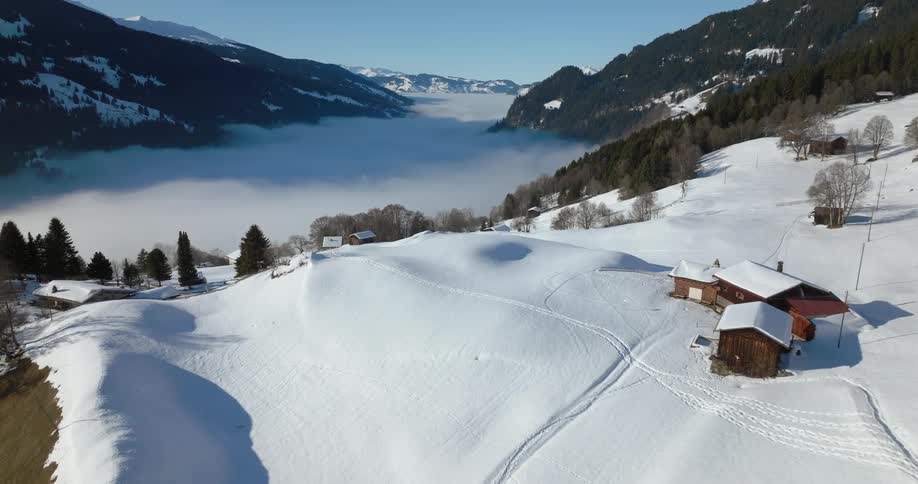 Mountain village covered in snow and fog with a beautiful view