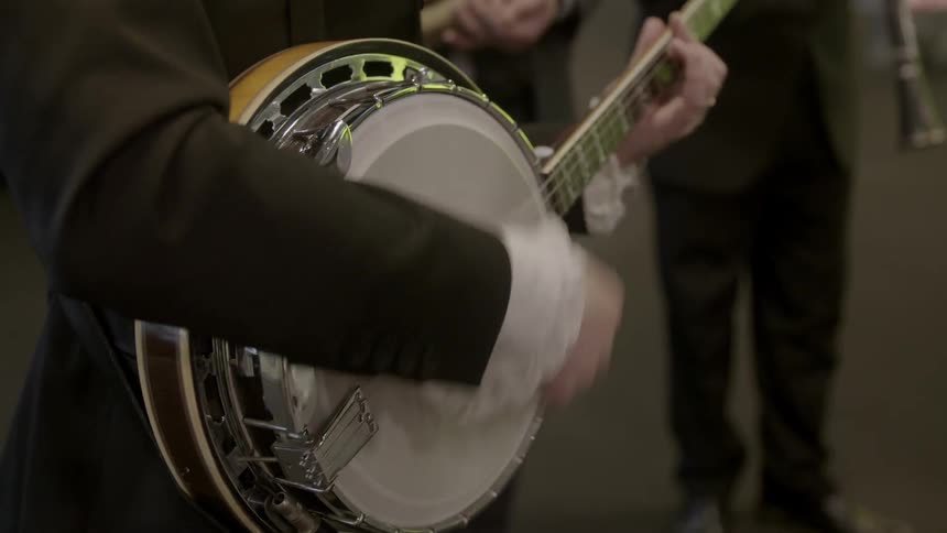 Close up of people playing musical instruments