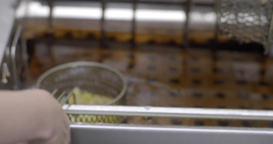 Food is placed in a deep fryer