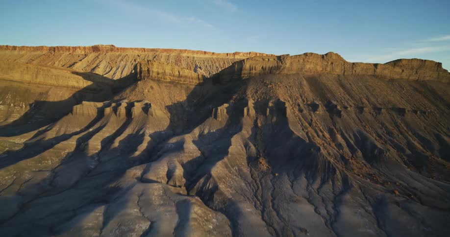 Mountains and rock formations in the desert badlands under a cloudy sky