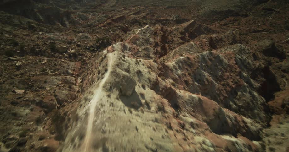 Badlands lead to plains bordered by mountains