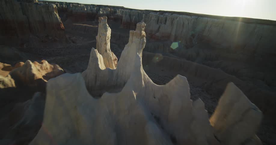 Formations protrude from the inside of a desert canyon