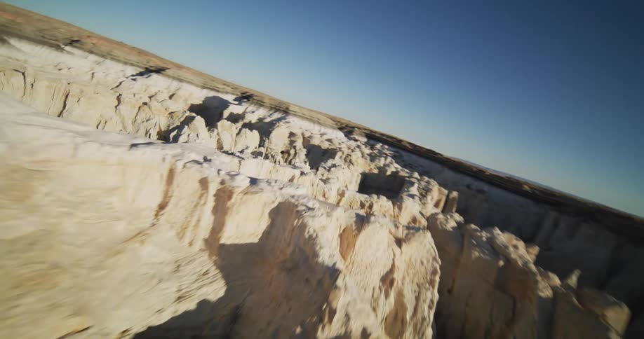An aerial view of a landscape with a canyon