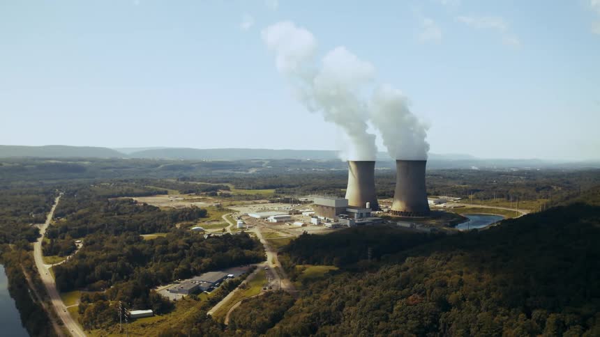 Aerial view of a rural area with a nuclear power plant is displayed