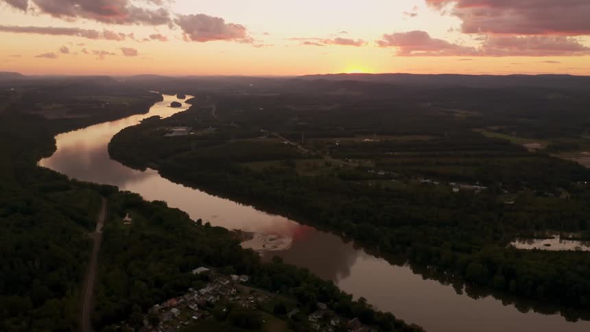 Aerial view of the susquehanna river next to town at sunset
