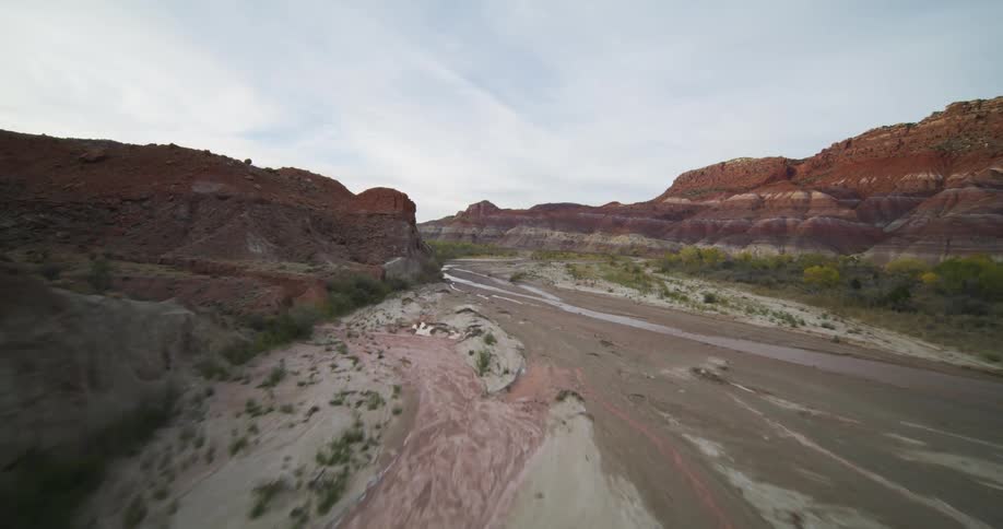Aerial view of a dry river bed through the badlands at morning