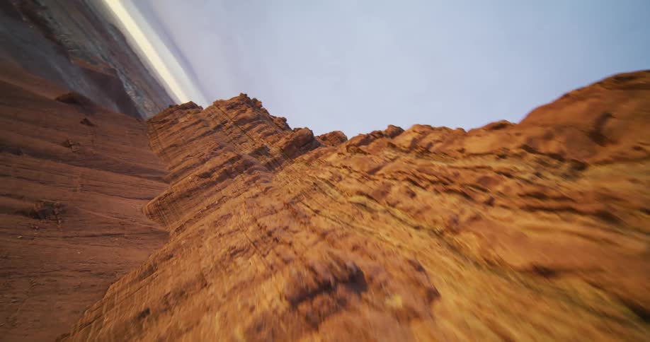 Tall formations stand at the top of a desert slope