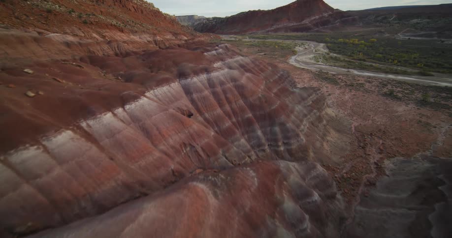 Aerial view of canyons with vegetation is displayed