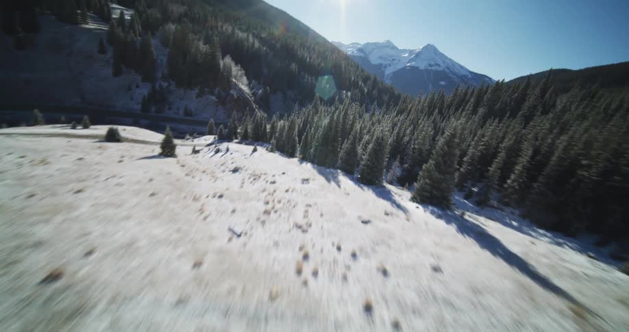 Aerial view of mountain slope with a large area of land that is thickly covered with trees