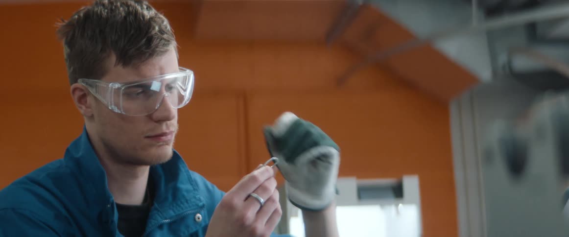 A man is in a labratory and working