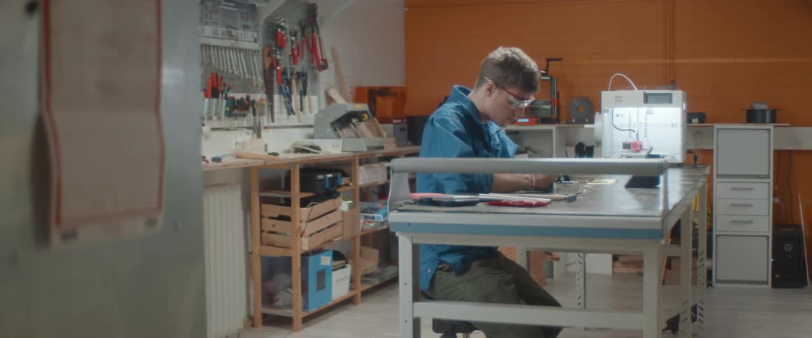 A man is working in a laboratory by himself