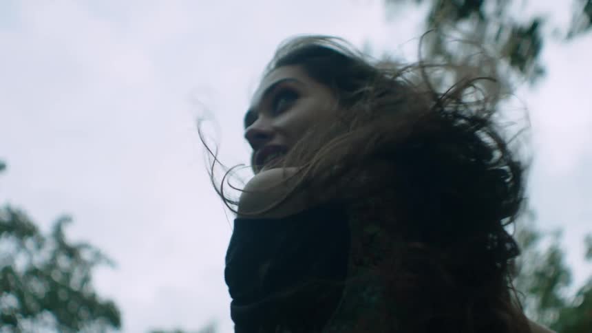 A person's hair blowing in the wind
