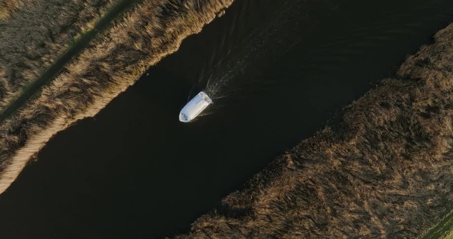 A view of a boat sailing down a river