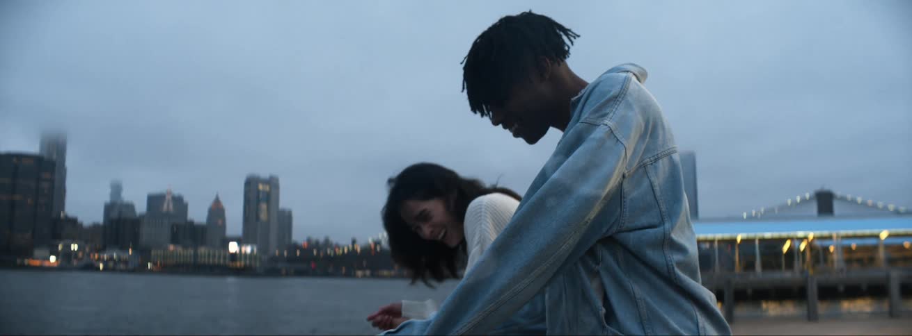 A man and woman standing outside talking