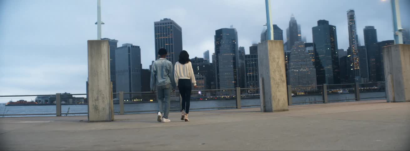 A view of two people walking outdoors