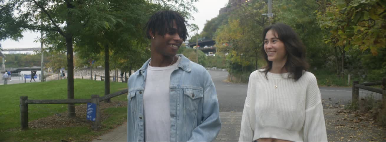 Boyfriend and girlfriend are walking outdoors together in spring