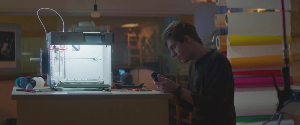 A male engineer examining an object in the workplace