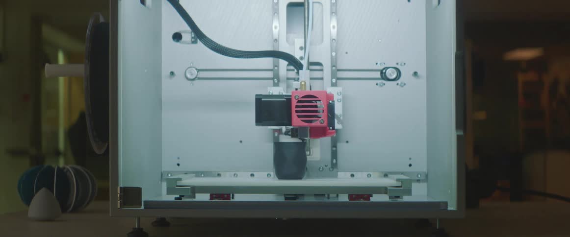 A view of a cnc machine working on a piece of metal